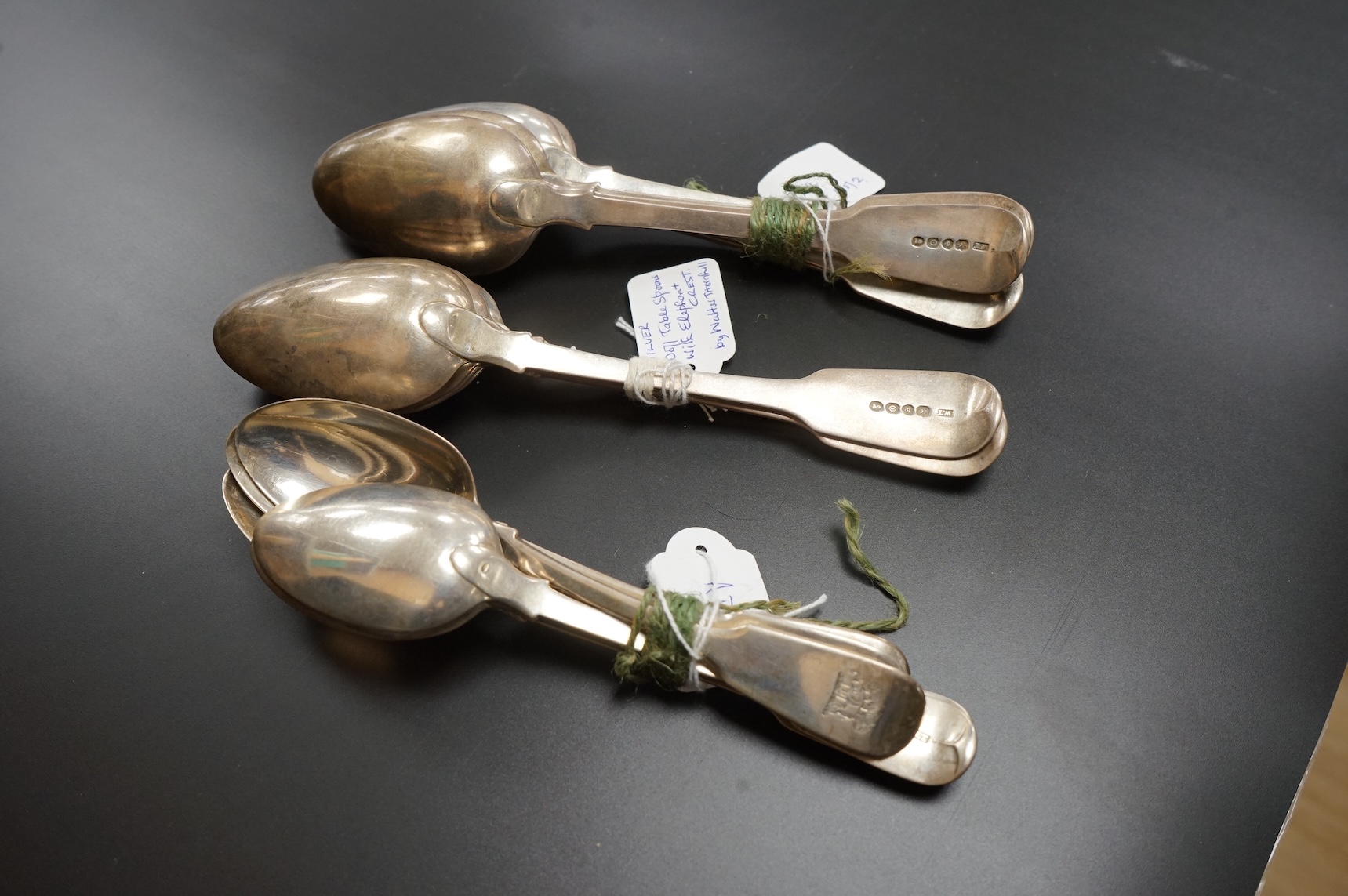 A set of ten George IV silver fiddle pattern table spoons and five dessert spoons by William M. Traies, London, 1829 and one other matched silver dessert spoon, 32.7oz.